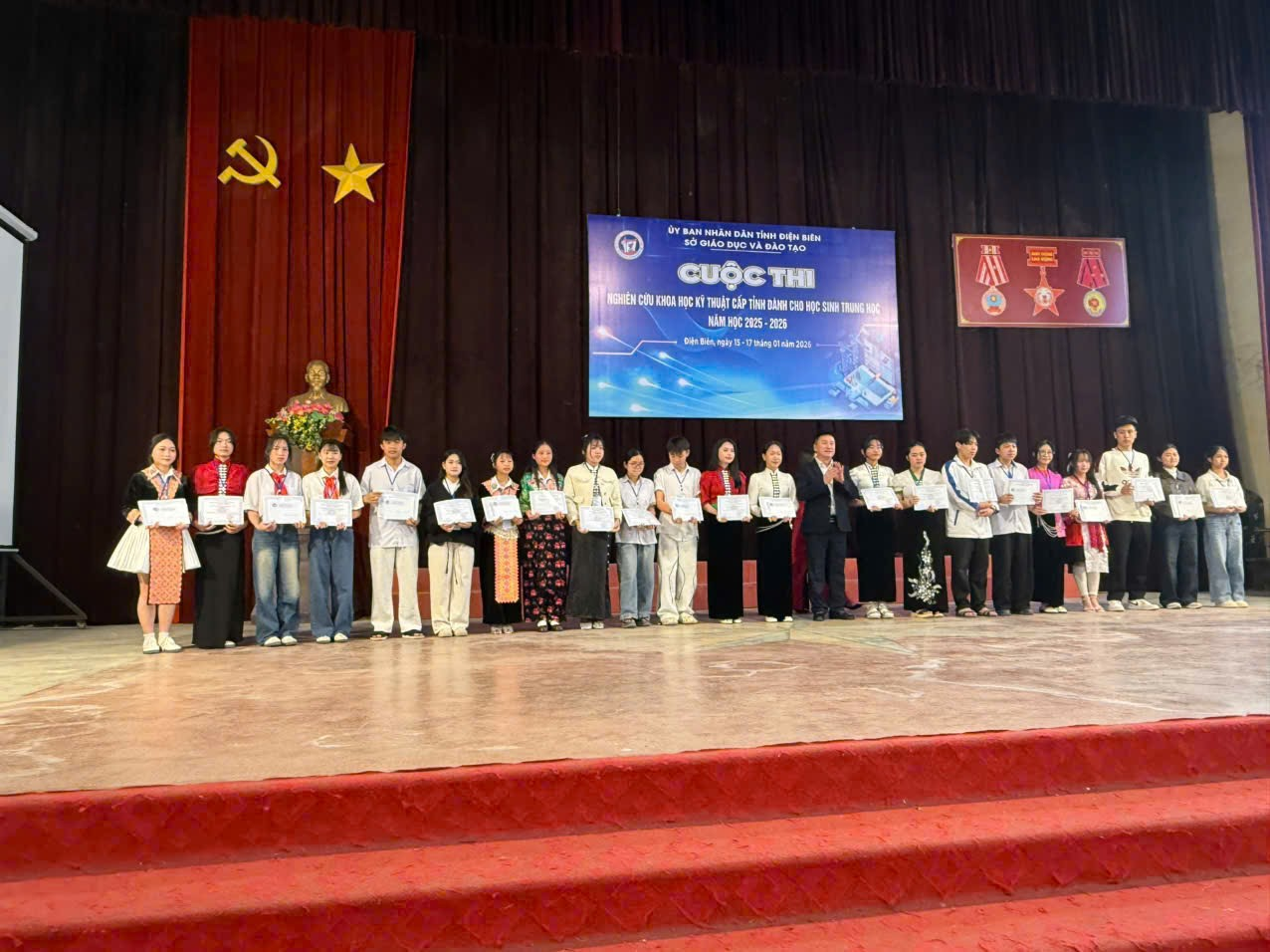 ''''A group of people standing on a stage

Description automatically generated''''