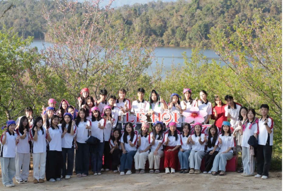 ''A group of people posing for a photo
Description automatically generated''