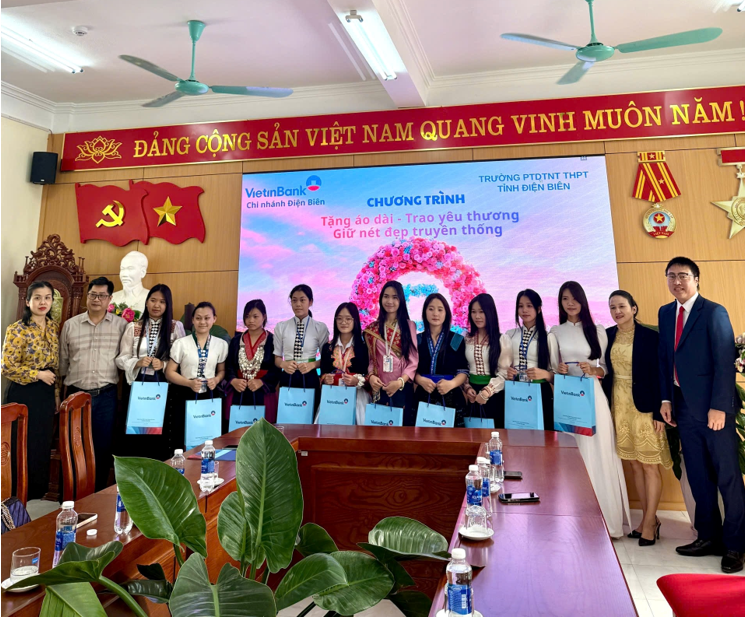 '''A group of people posing for a photo

Description automatically generated'''