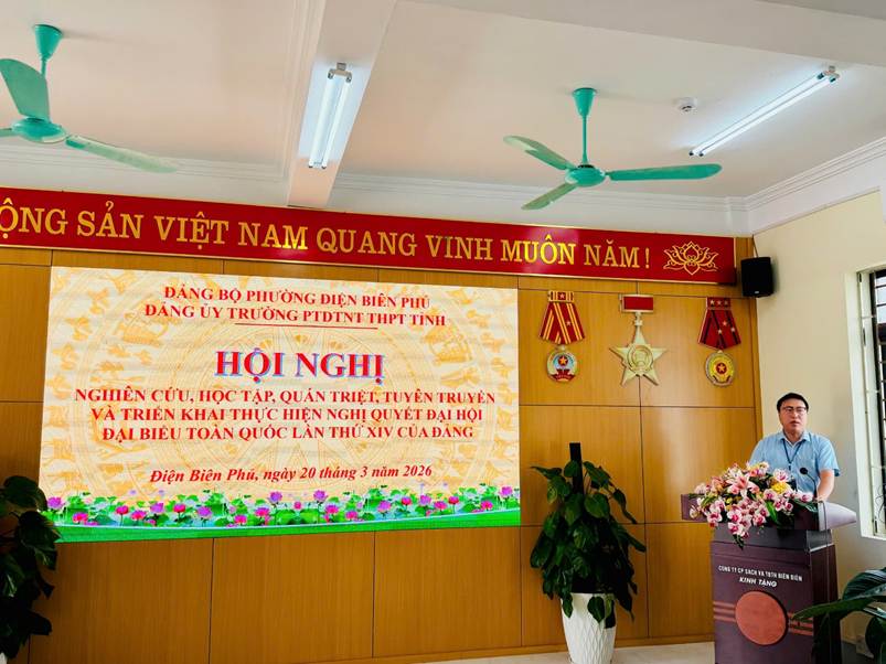 '''A person standing in front of a screen

Description automatically generated'''