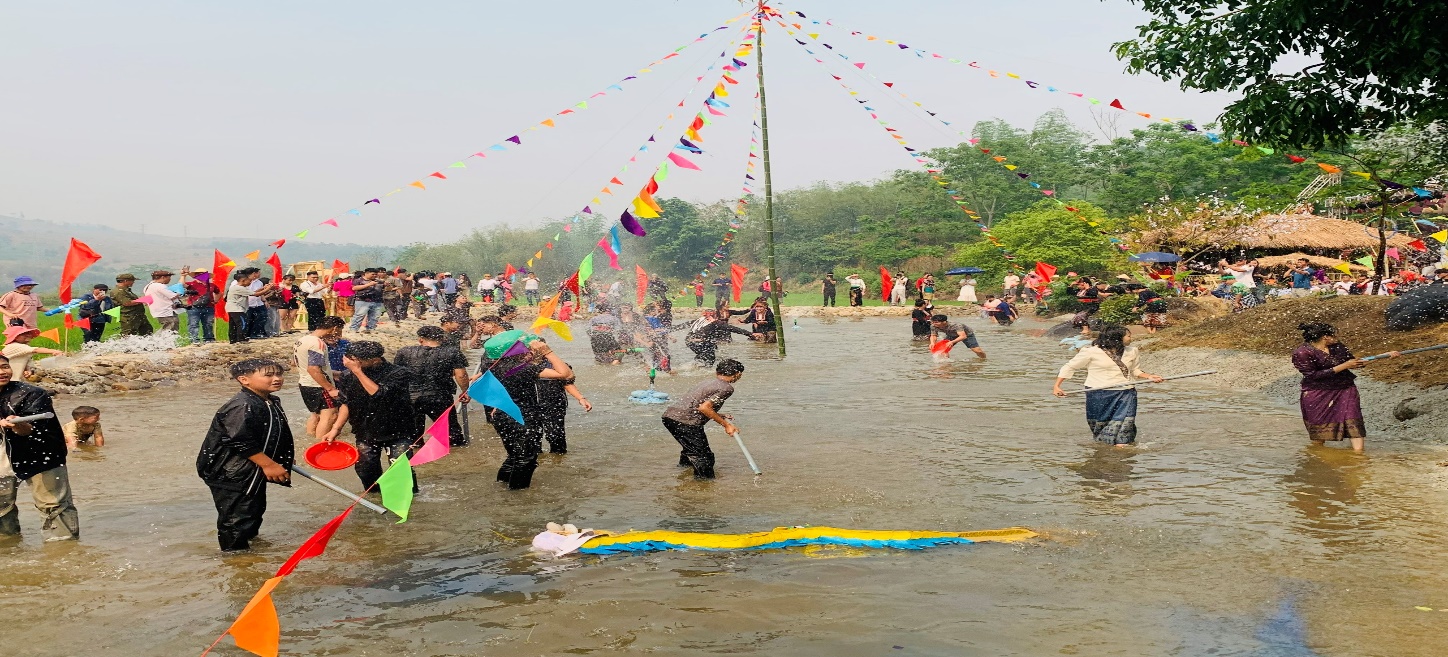 '''A group of people in a muddy area
Description automatically generated'''