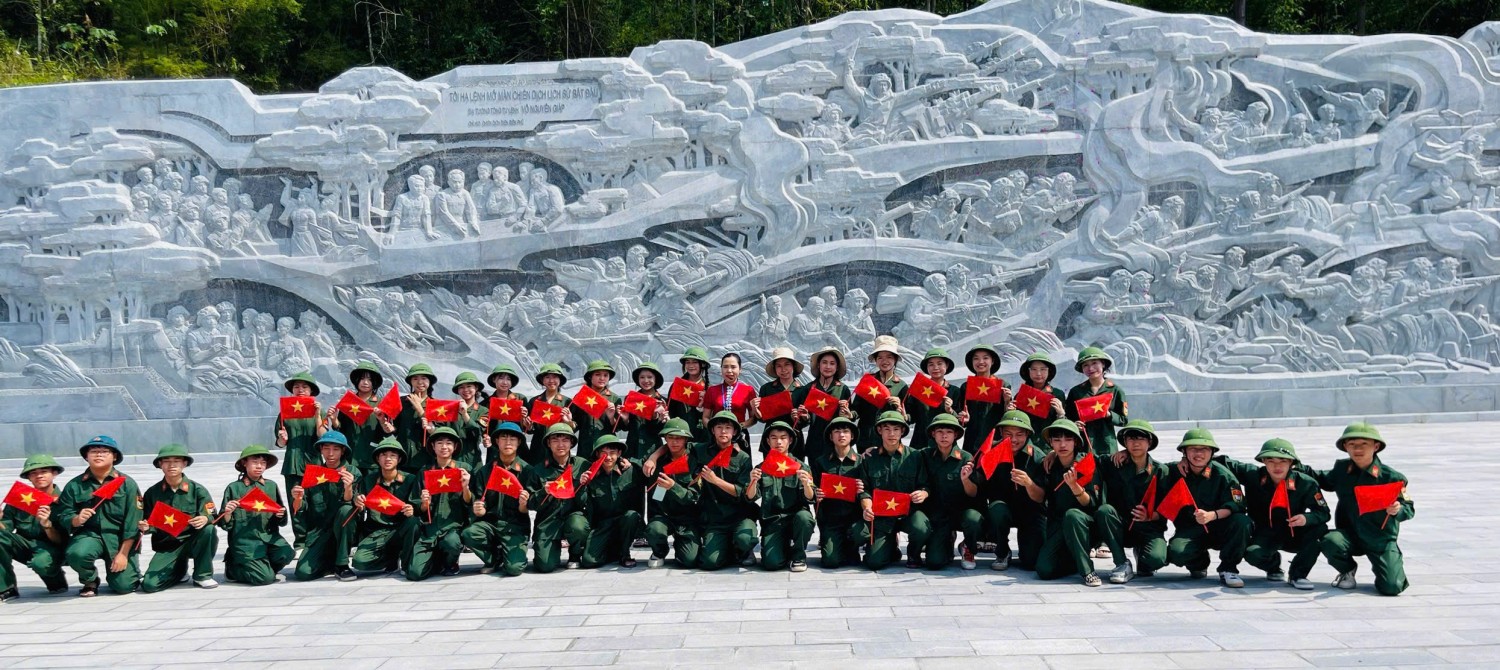 ''A group of people in uniform posing for a photo

Description automatically generated''